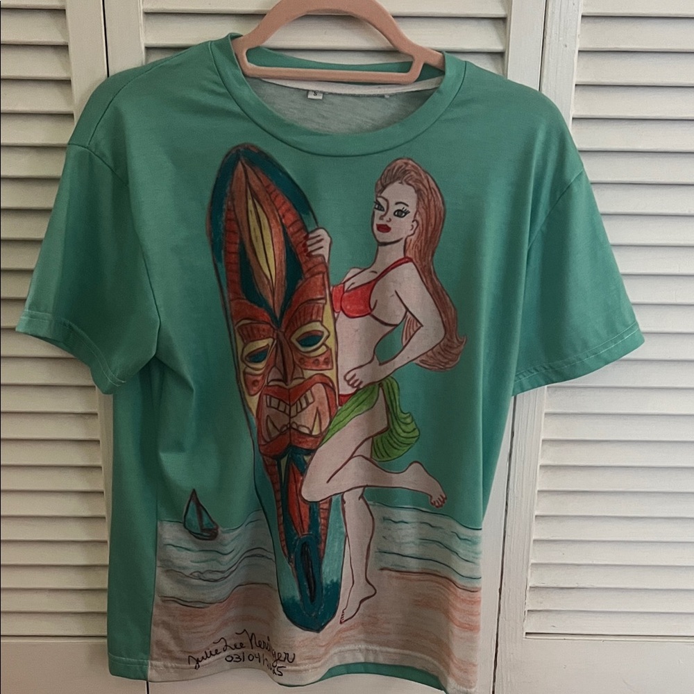 (S) Tiki woman Graphic T’shirt with Surfboard Designed by Julie Lee Nersinger - Picture 1 of 11